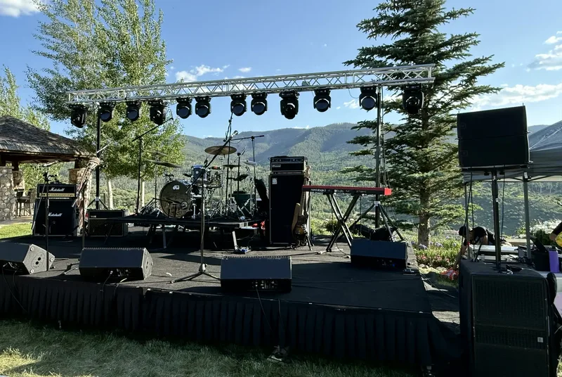 Stage setup with mountain views for Pistol Blonde's live performance in Vail, Colorado